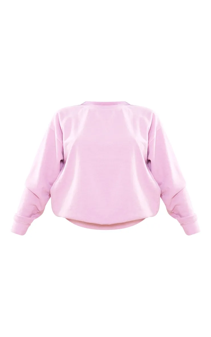 Sweat oversize rose pastel effet délavé